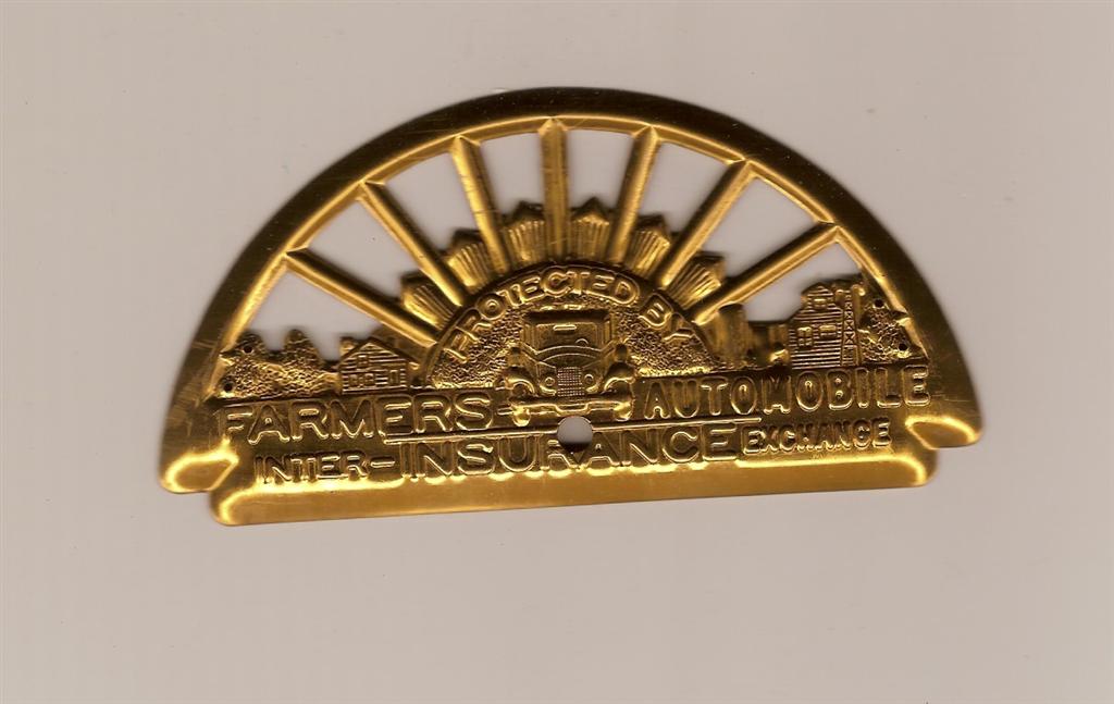 Mint, copper grill emblem from the Farmers Automob