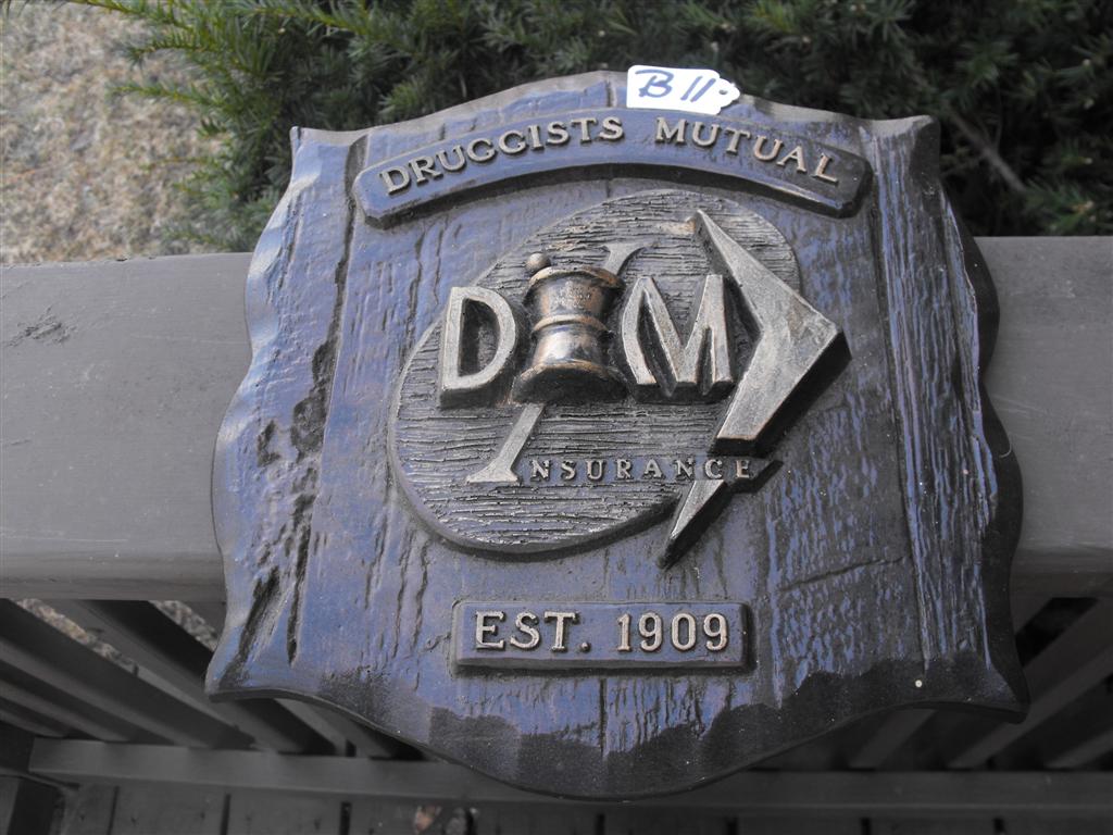 Druggists Mutual Insurance Plaque. Heavy wood-lik