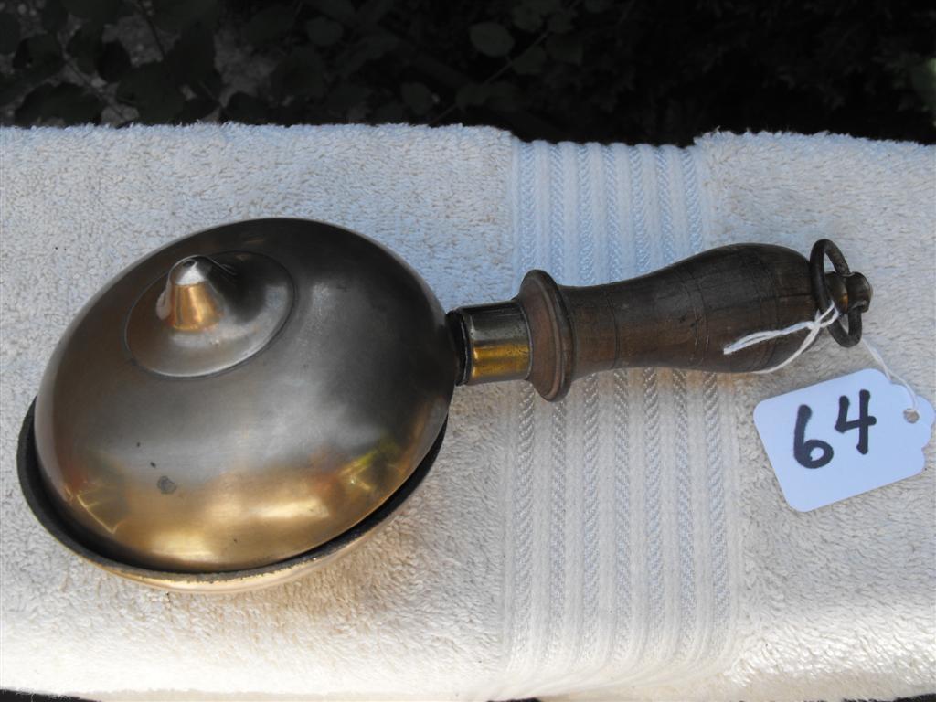Brass Muffin Bell with Wood handle. The inside of