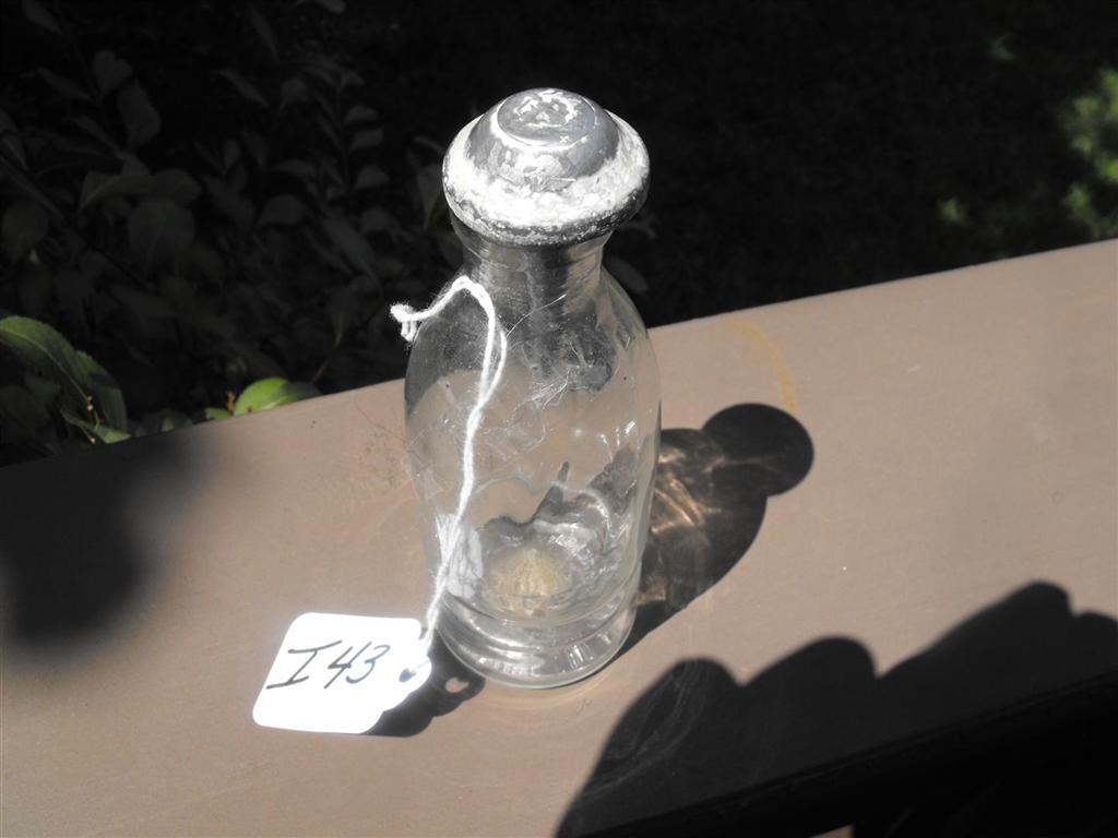 Acid Bottle. Clear bottle 5" high with original m