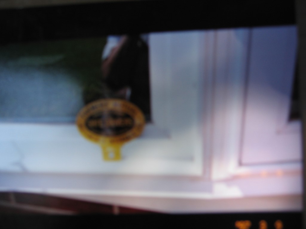 Farmers Mutual Auto Tag. Tin. 4 1/2x3.