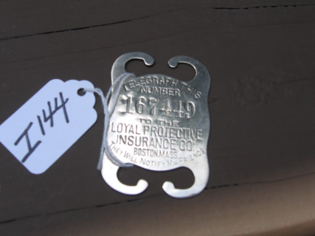 Small Metal Holder. 2 1/2x1 3/4. Front says Tele