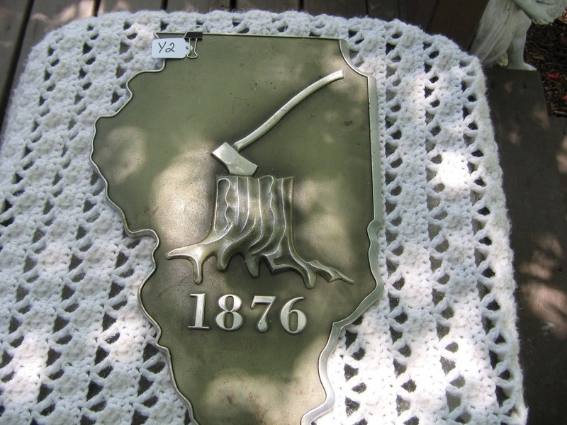 Sign. Shape of Illinois. Metal. Grey Background