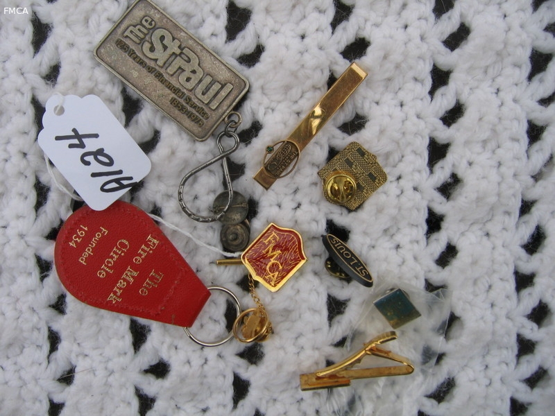 Various pins, tie tack key holders. Several from