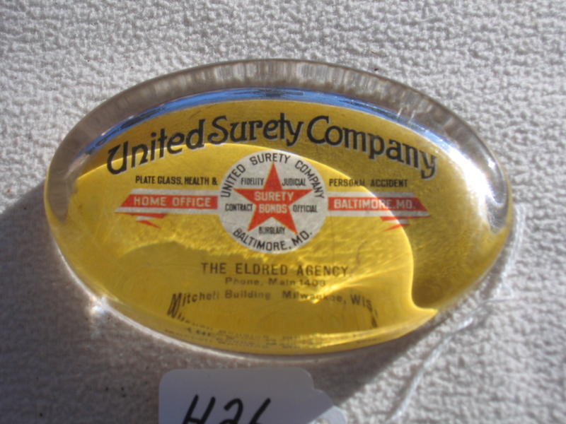 United Surety Company Paperweight. Oval. 4 3/8x2