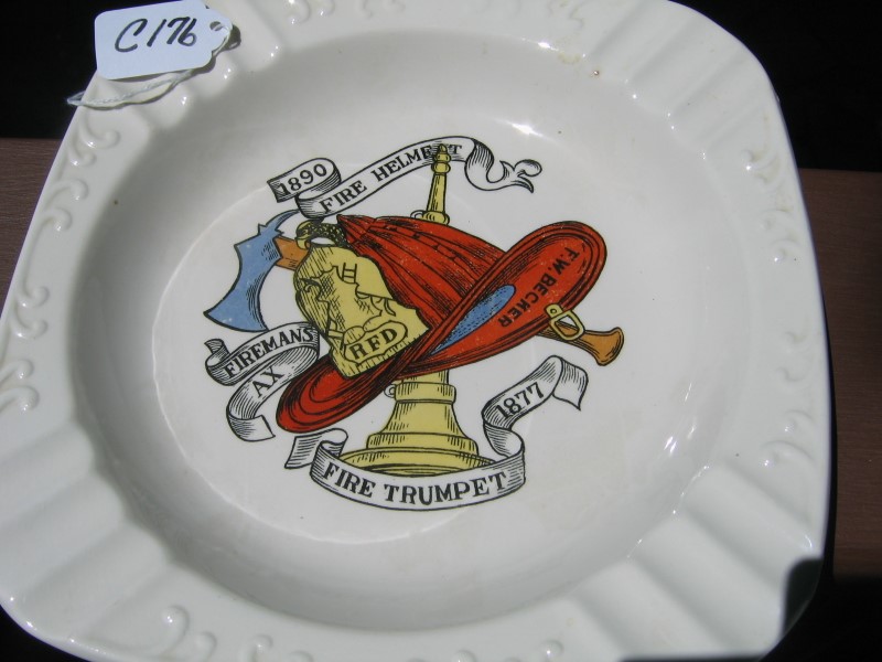 White Ashtray with Various Fire Items in the Middl