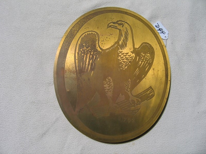 Brass Oval Advertising Piece. Replica of the Eagl