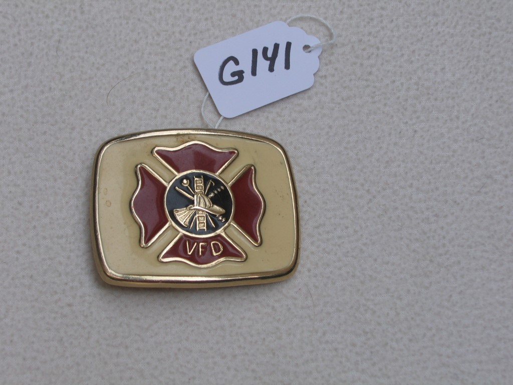 Belt Buckle. Gold Plated Metal with Cream Backgro