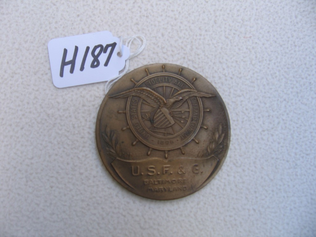 U.S.F.G. Paperweight with Slightly Raised Emblem o