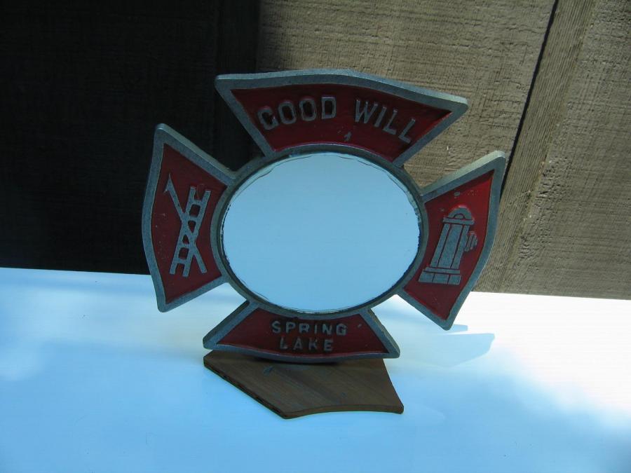 #057 Fire items on a mirror. Good Will, Spring Lake.