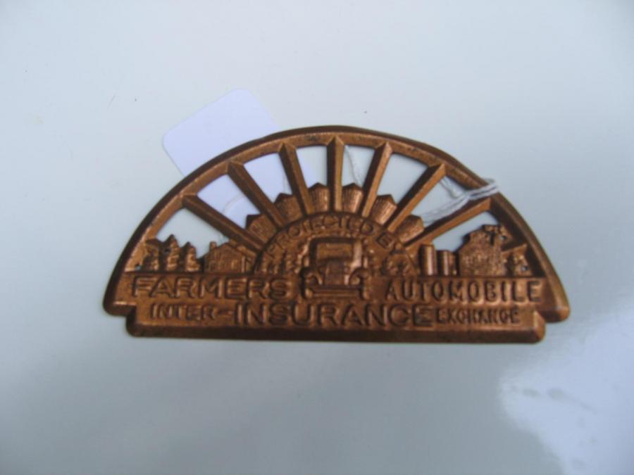 #007 FARMERS AUTO INSURANCE. AUTO TAG.   Protected by Inter Exchange.