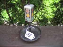 Ashtray. Heavy metal. 6 1/4" tall. Says "We are