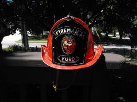 Firemans Fund Helmet. Red metal helmet. Very good