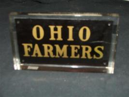 Genuine Ohio Farmers Fire Mark encased in lucite.