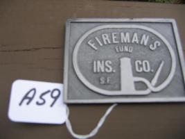 Firemans Fund Ins. Co. Paperweight. Metal. On ba