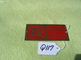 Brass Metal Plaque with Red Background. Highland