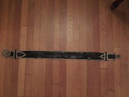 Picture of ACTIVE back of belt. There is a Brass