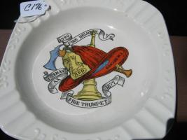 White Ashtray with Various Fire Items in the Middl