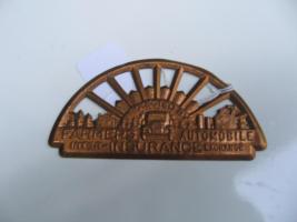 #007 FARMERS AUTO INSURANCE. AUTO TAG.   Protected by Inter Exchange.